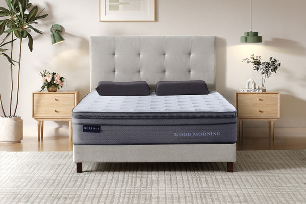 Gray mattress with 'Good Morning' branding in a bedroom setting.