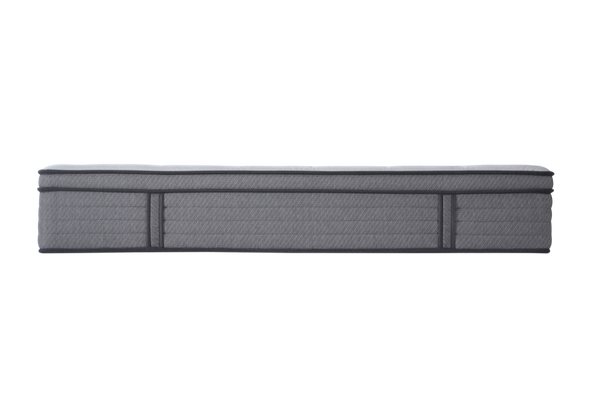 Side shot of a grey mattress on a white background