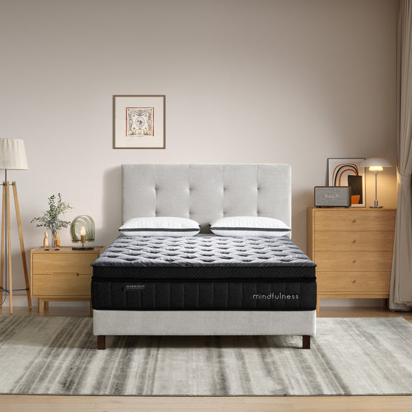 Bed with 'mindfulness' mattress in a bedroom setting