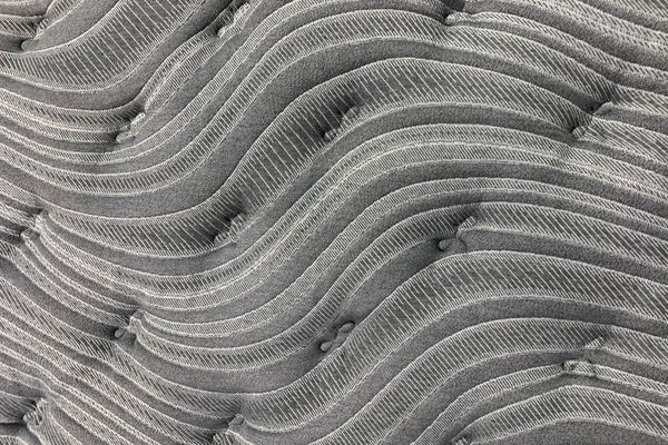 Close up photo of the tufted quilting on a Morrison Mindfulness mattress